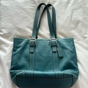 Coach blue handbag.